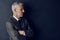 Hes eagle eyed in money matters. Studio shot of a mature businessman against a dark background.