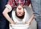 Hes an easy target. Closeup portrait of a nerdy guy getting dunked in the school toilet.