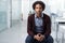 Hes focussed on being a success at work. a young businessman sitting in an office.