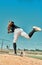 Hes giving it his all. Shot of a young baseball player pitching the ball during a game outdoors.