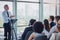 Hes got a wealth of experience to share. High angle shot of a handsome mature male speaker addressing a group of