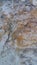 Hewn stone surface. White-orange stone surface.