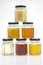 Hexagonal jars with different types and colors of fresh flower honey. vitamin food for health and life