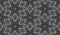 Hexagonal seamless pattern of white lines on black. Ceremonial repeatable ornament in moire style