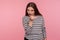 Hey you, approach to me! Portrait of attractive seductive woman in striped sweatshirt gesturing with one finger