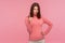 Hey you, be careful! Strict bossy woman with brown hair in pink sweater seriously pointing finger and looking at camera, warning