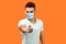 Hey you! Portrait of bossy rigid man with medical mask in casual white t-shirt pointing finger at camera and looking with strict