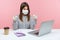 Hey you, stay and work home! Woman office employee sitting safe healthy with hygienic face mask