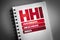 HHI - Herfindahlâ€“Hirschman Index acronym on notepad, business concept background