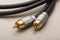 Hi-Fi RCA gold audio cable on paper background