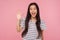 Hi! Portrait of friendly charming girl with long brunette hair in striped t-shirt saying hello and waving hand