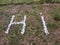 hi written with white stones on grassland floor sign unique