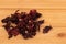 Hibiscus tea on a wooden background. Tea benefits concept