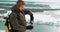 hicker in winter drinks tea in nature, a guy pours tea from a thermos