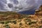 Hickman Bridge Trail in Capitol Reef National Park under the cloudy sky