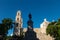 Hidalgo park with statue and doves with view on church `El Jesus` in Merida, Yucatan, Mexico