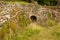 Hidden alcove under garden flint stone wall