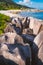 Hidden beach with unique huge granite rocks, jungle beach and ocean lagoon, Grand L Anse, La Digue, Seychelles