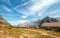 HIDDEN LAKE HIKING TRAIL ON LOGAN PASS UNDER CIRRUS CLOUDS DURING THE 2017 FALL FIRES IN GLACIER NATIONAL PARK IN MONTANA USA