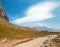 Hidden Lake hiking trail under lenticular cloud on Logan Pass in Glacier National Park during the 2017 fall fires in Montana USA