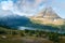 Hidden Lake and pyramid-shaped Bearhat Mountain in Glacier National Park, Montana, USA. Early morning light and scattered clouds