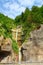 Hidden mountain waterfall in the beautiful and popular village of Hallstatt located in Austria, Europe