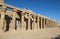 Hieroglyphic carvings on columns at an ancient egyptian temple