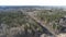 High aerial drone view of an railroad across the spring forest. Rural places