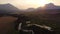 High aerial shot over the Crowsnest River with Canadian Rocky Mountains and train tracks