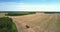 High aerial view agricultural equipment stands on field