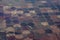 High aerial view of the crop circles created in farm fields by center pivot sprinklers