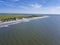 High aerial view of Folly Beach, South Carolina from the sea