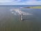 High aerial view of the Morris Island Lighthouse with Folly Beach in the background