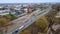 High aerial view of truck with cargo trailer driving through a small town