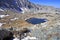 High altitude clear alpine lakes in the Rocky Mountains, as viewed from a mountain summit above.