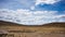 High altitude landscape with harsh barren landscape and scenic dramatic sky. Wide angle view from above at 4000 m on the Andean hi