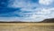 High altitude landscape with harsh barren landscape and scenic dramatic sky. Wide angle view from above at 4000 m on the Andean hi