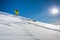 High altitude mountain explorer walking through deep snow