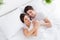 High angle above view photo adorable lady husband guy couple lying comfortable sheets bed white blanket morning hugging