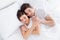 High angle above view photo charming cute lady husband guy couple lying comfortable sheets bed white blanket hugging