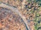 High angle aerial bird`s eye drone view of a bushfire affected country road near Sydney, New South Wales, Australia