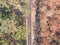 High angle aerial bird`s eye drone view of a bushfire affected country road near Sydney, New South Wales, Australia