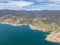 High angle aerial drone view of Blowering Reservoir dam near Tumut in the Snowy Mountains region of New South Wales, Australia