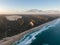 High angle aerial drone view of famous Seventy Five Mile Beach near Dundubara Creek on Fraser Island, Queensland, Australia