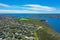 High angle aerial drone view of Grotto Point and Washaway Beach in the suburb of Clontarf, Sydney, New South Wales, Australia.