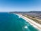 High angle aerial drone view of Lawyers Head Beach, Saint Kilda Beach and Saint Clair Beach one continuous beach in Dunedin