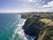 High angle aerial drone view the steep coastline at the south end of St Clair, a beachside suburb of Dunedin