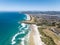 High angle aerial drone view of Tomahawk Beach, Lawyers Head and beach, Saint Kilda Beach and Saint Clair Beach front to back