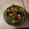 High-angle closeup of a bowl with botanical composition.