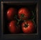 High angle closeup shot of four fresh tomatoes in a wooden box - perfect for a recipe article